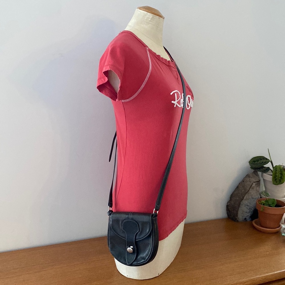 Eco-Lab crossbody mini purse. Button closure w/adjustable strap. Vegan leather.